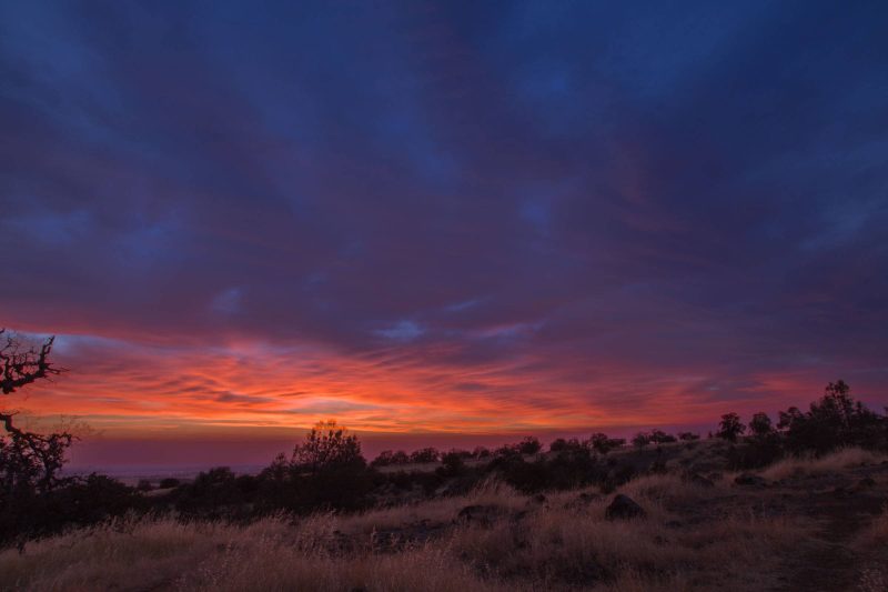 A pink and orange sky at sunset from the North Rim Trail in Upper Bidwell Park.