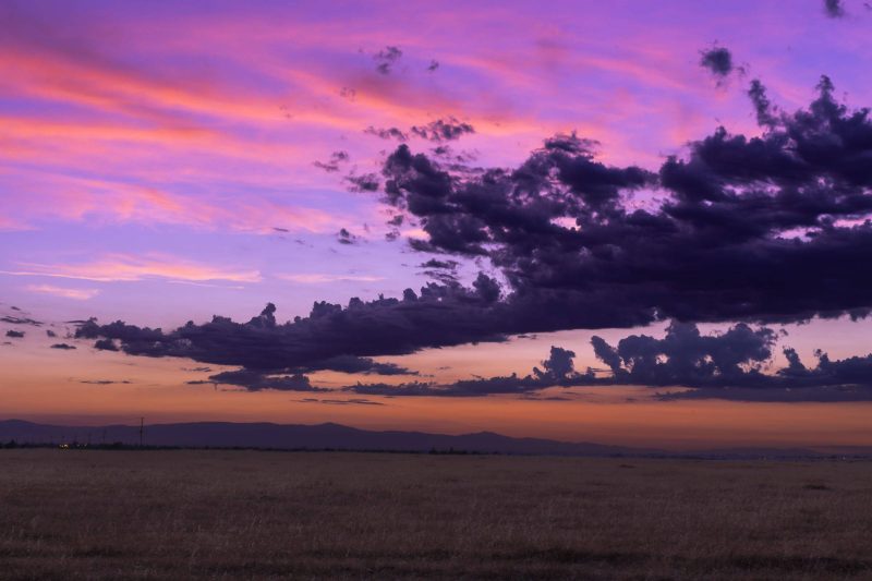 A finger of a thunderstorm cloud clears Bidwell Park at sunset.