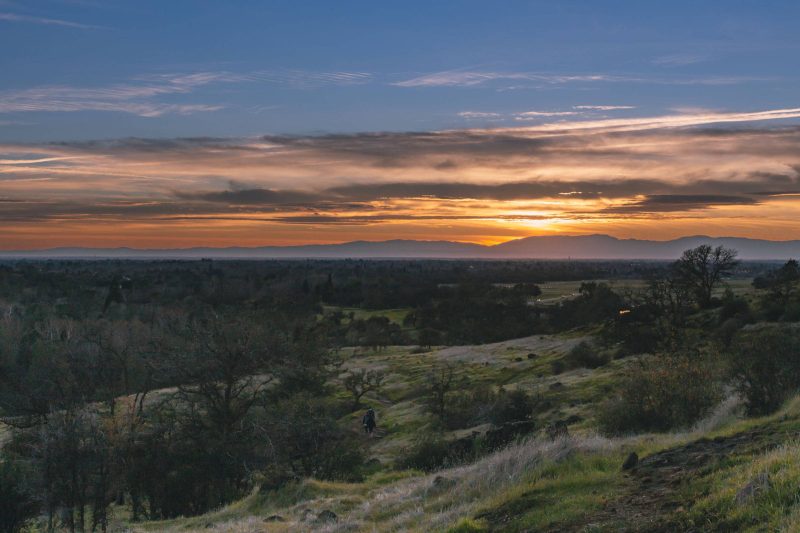 Hikers on the trail at sunset.